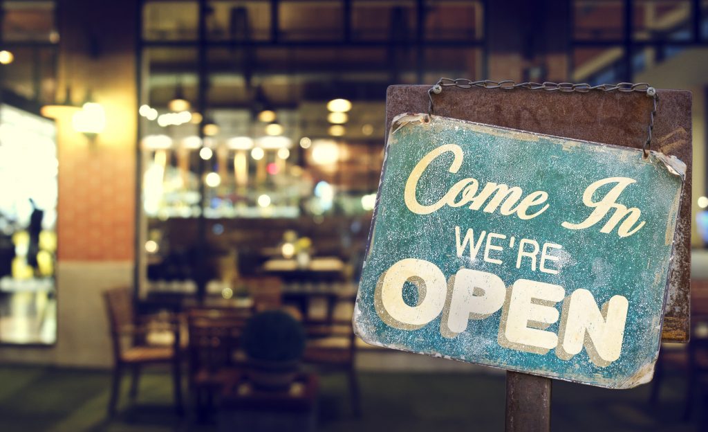 open sign hanging outside a restaurant, store, office or other